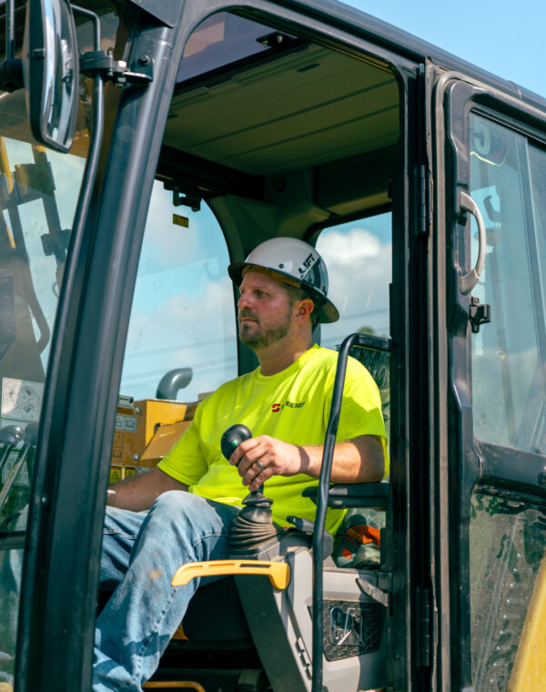 Sweeney employee sitting in excavator, operating equipment, hard hat, 24075_BUILDWITT_1614